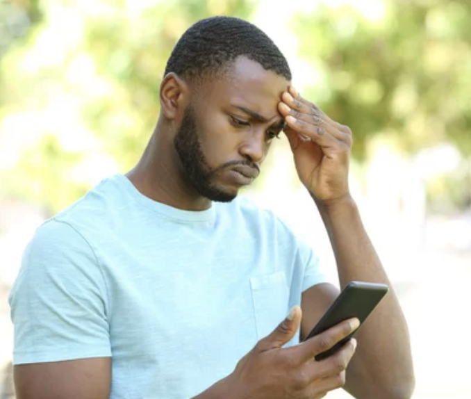 man looking concerned at phone